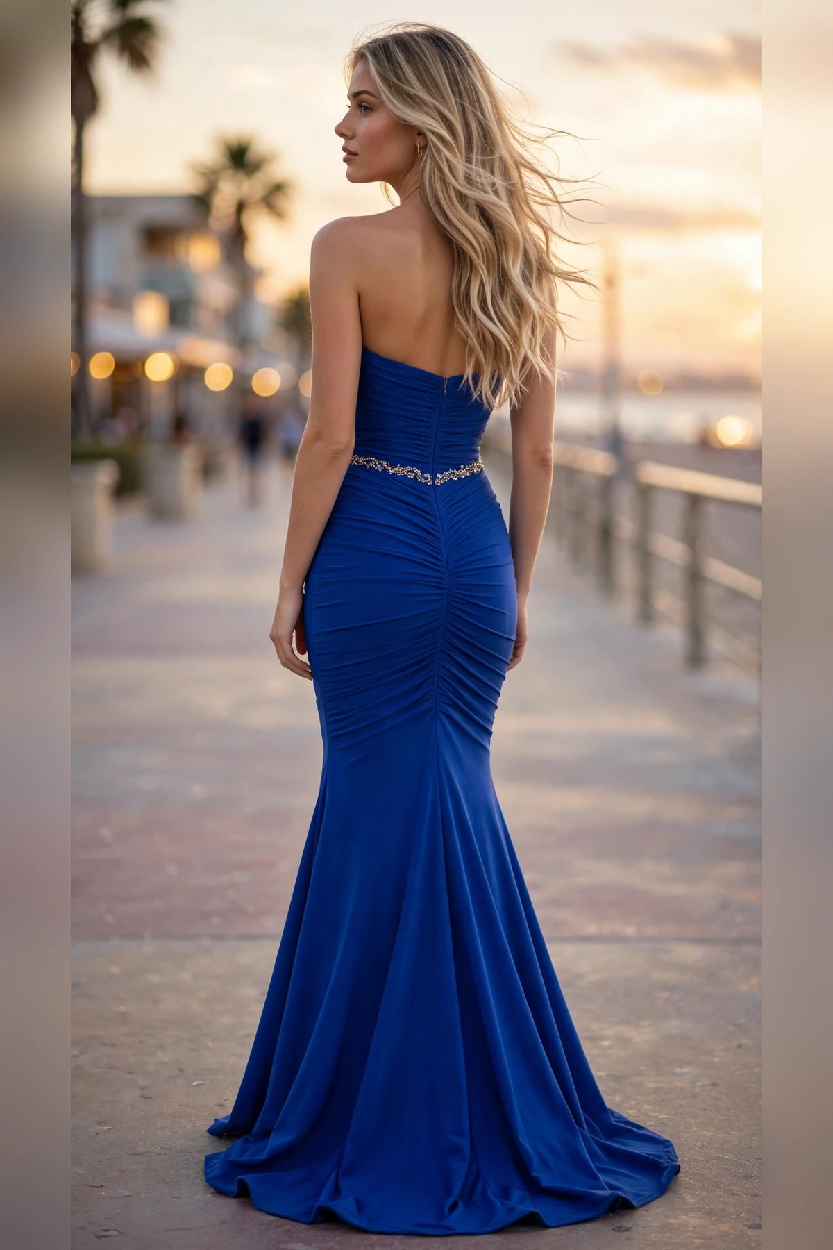 Royal blue strapless ruched mermaid prom dress with beaded waistband, back view | PromGirlOutlet