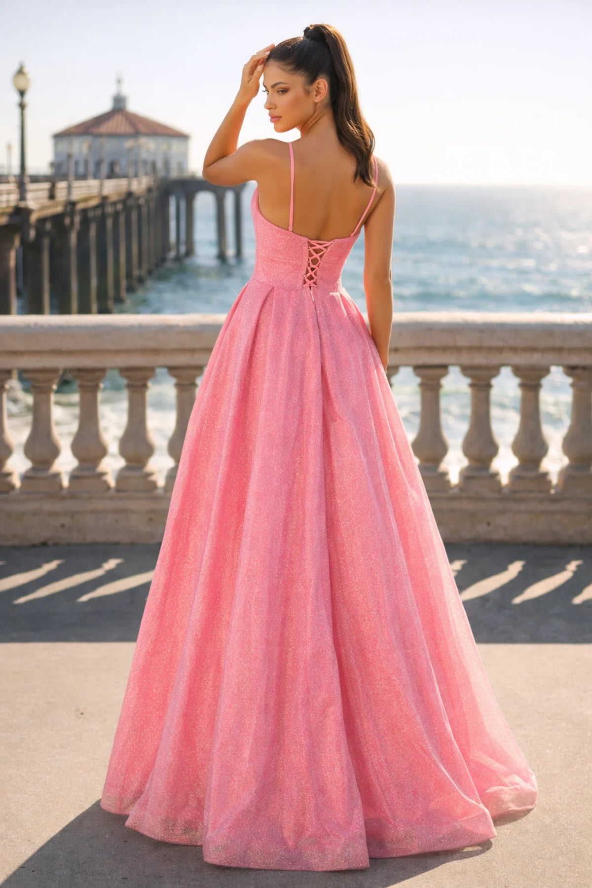 Pink shimmer A-line prom gown with crystal V-neckline and lace-up corset back
