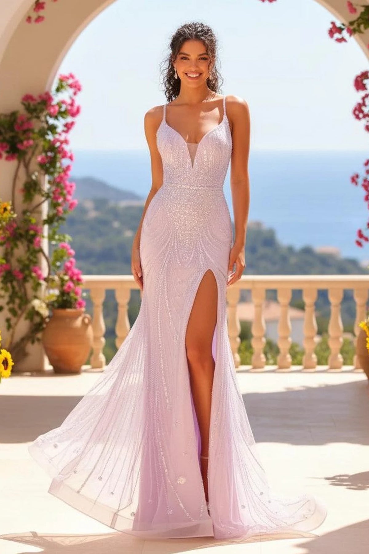 Pale lilac beaded prom dress with plunging V-neck, double crisscross straps, and thigh-high slit