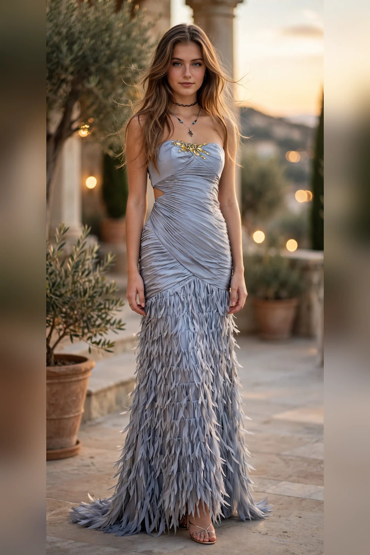 Silver strapless ruched gown with gold crystal bust detail and feathered fringe skirt, front view | PromGirlOutlet