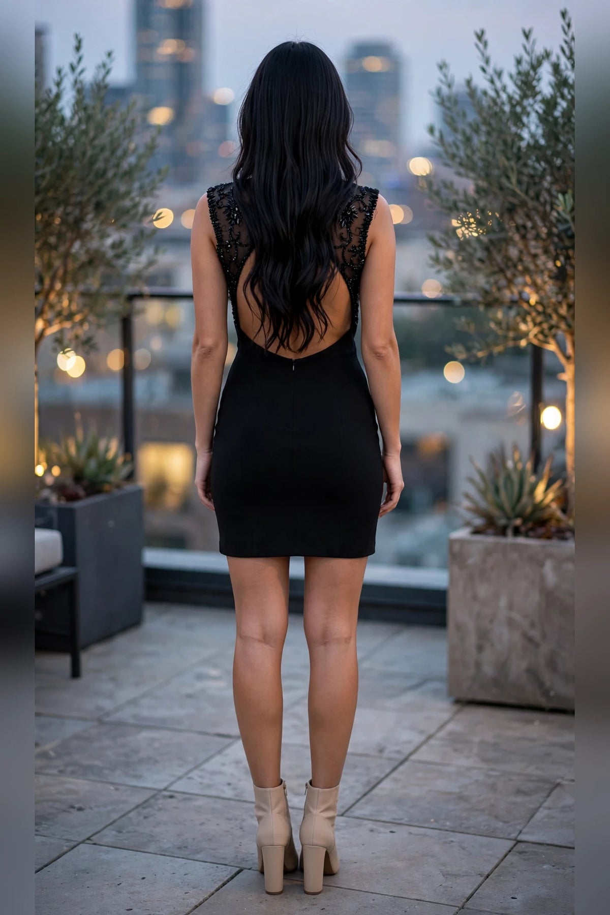 Black fitted short dress with beaded illusion yoke and open keyhole back, back view | PromGirlOutlet
